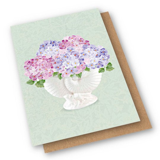 Card with ceramic nautilus vase on it