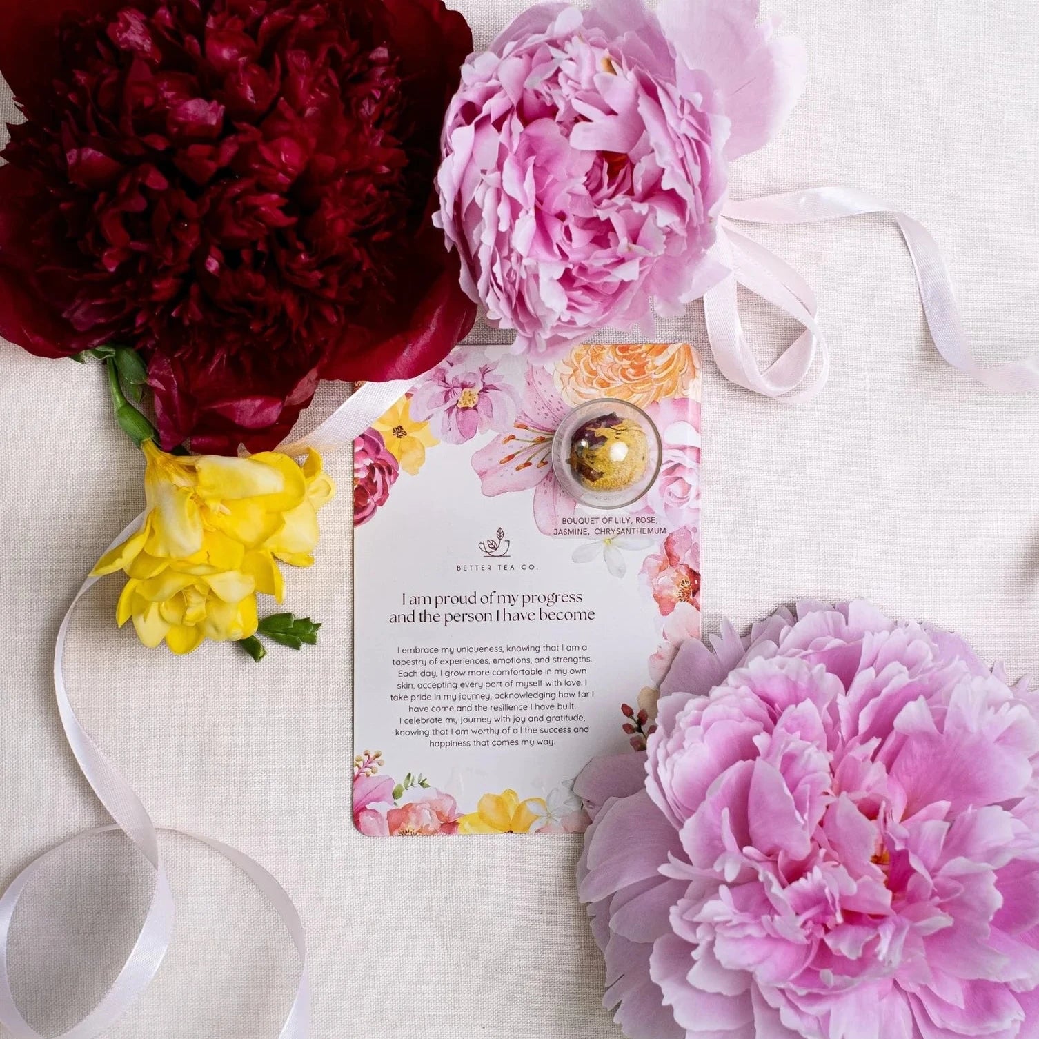 Blooming tea ball on a card with affirmation text