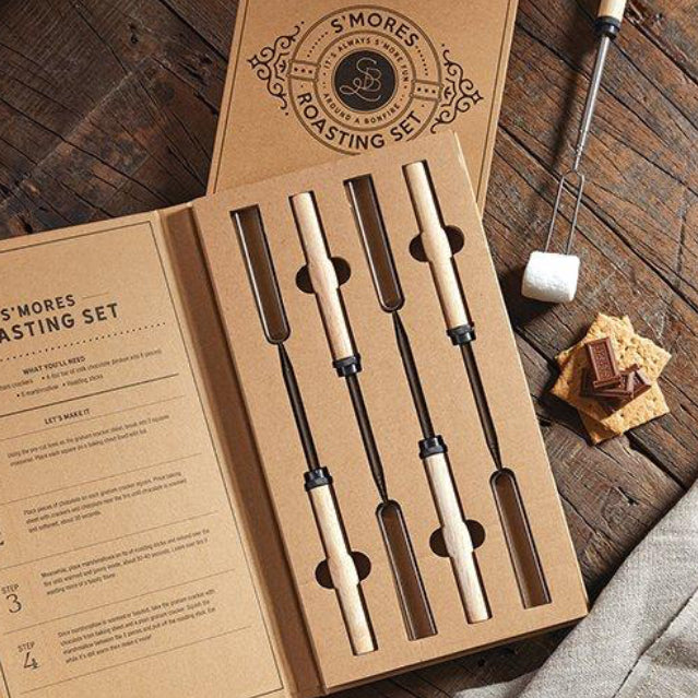 S’mores kit with forks and a packet of biscuits and a packet of marshmallows