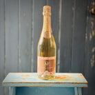 a bottle of AF Rosé, a heart-shaped slate cheese board with knife set, and a creamy Kapiti cheese, 
