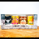 Rum & Que seasoning back of 4 cans of seasoning in a box