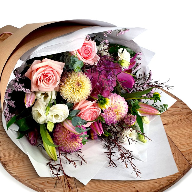 Fresh bouquet  held up infront of a wall from The Lost Flower Shed, Silverdale – same-day delivery North Shore, next-day Auckland