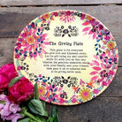 a large plate with a poem about giving