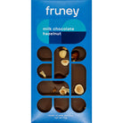 Two boxes of Ashley & Co  soothe tube and Fruney dark chocolate products on a wooden surface with tulips in the background.