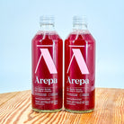 Bottles of Arepa Sparkling black current drink