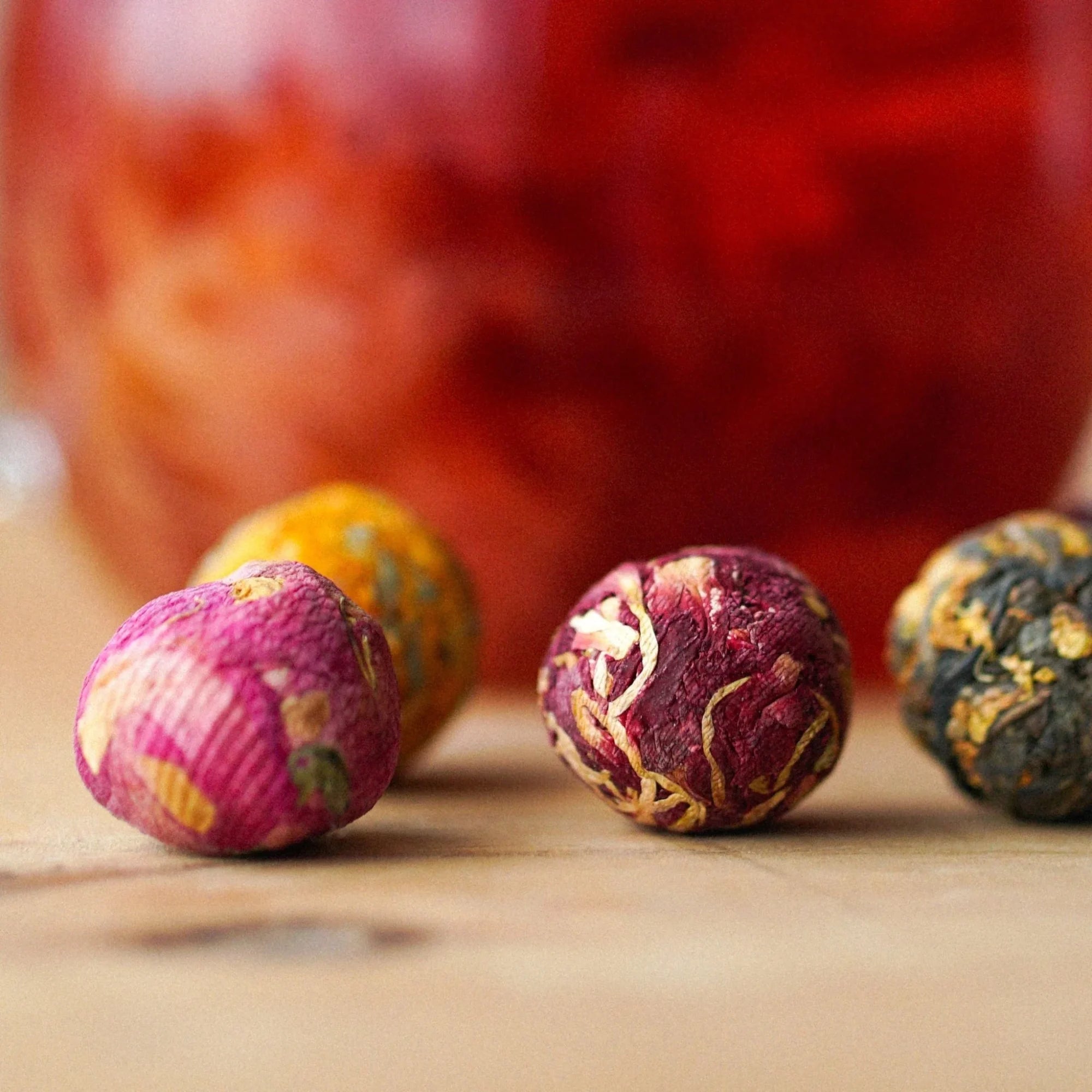 Floral packaging with blooming tea and cards on a light surface