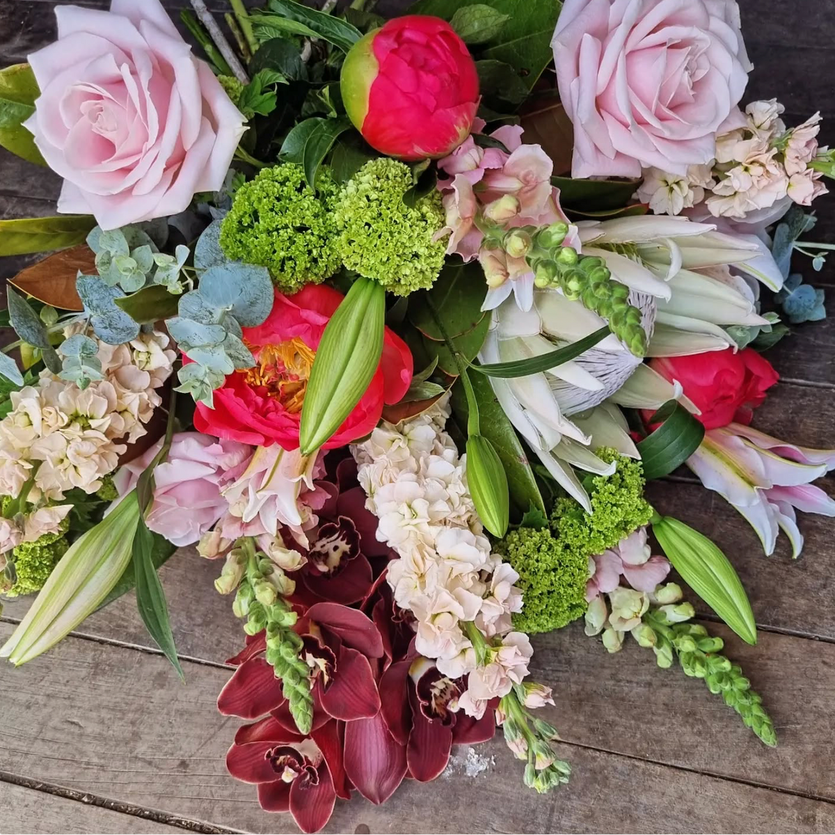 bouquet of pink roses snapdragons, and peonies
