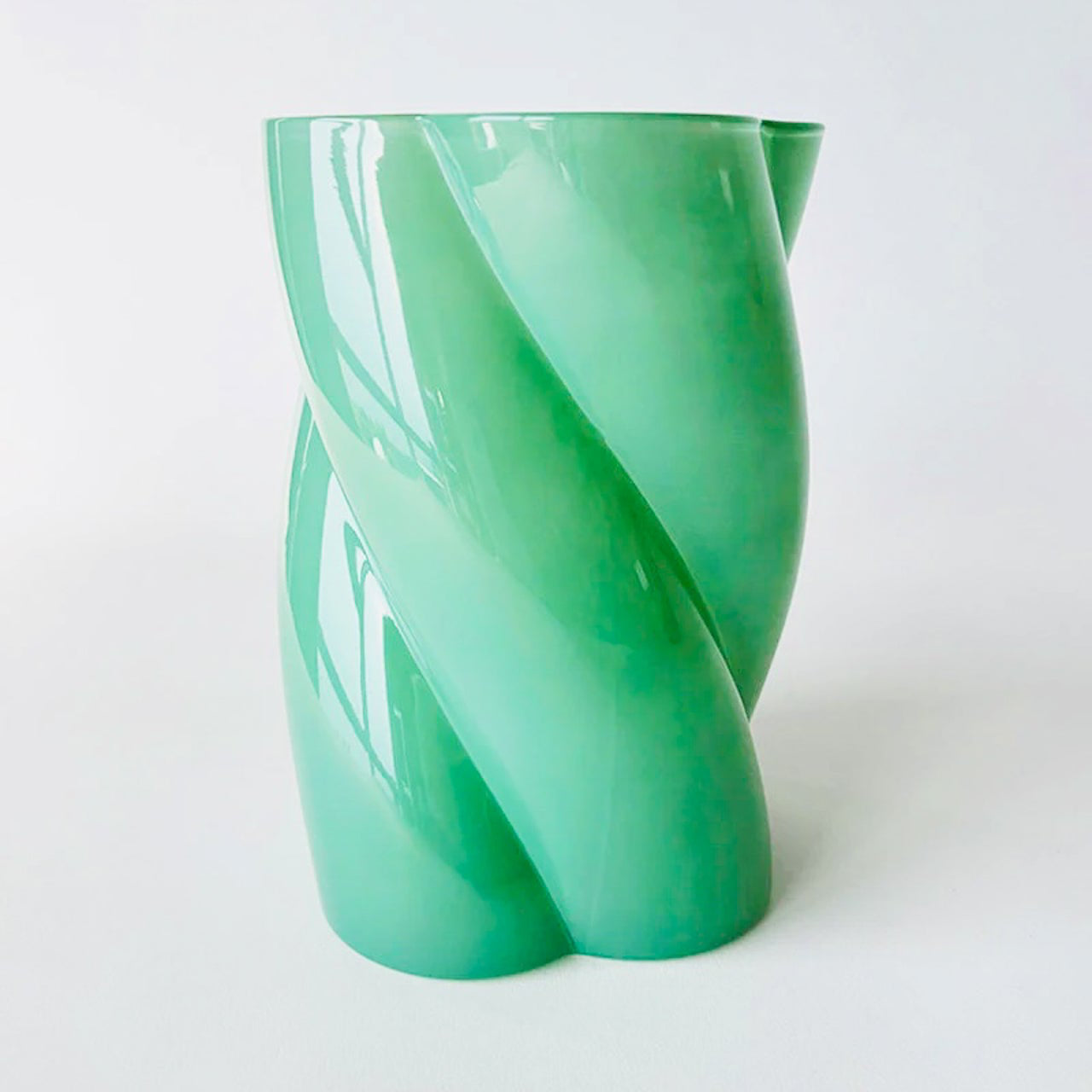 A green glass flower vase