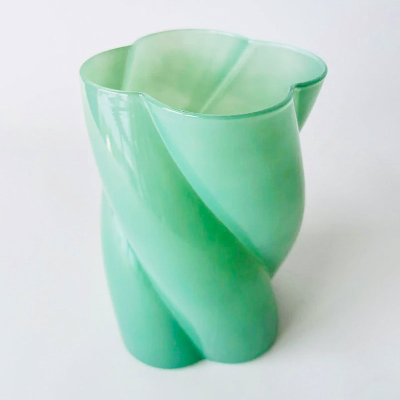 A green glass flower vase