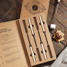 S’mores kit with forks and a packet of biscuits and a packet of marshmallows