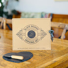 a bottle of AF Rosé, a heart-shaped slate cheese board with knife set, and a creamy Kapiti cheese, 