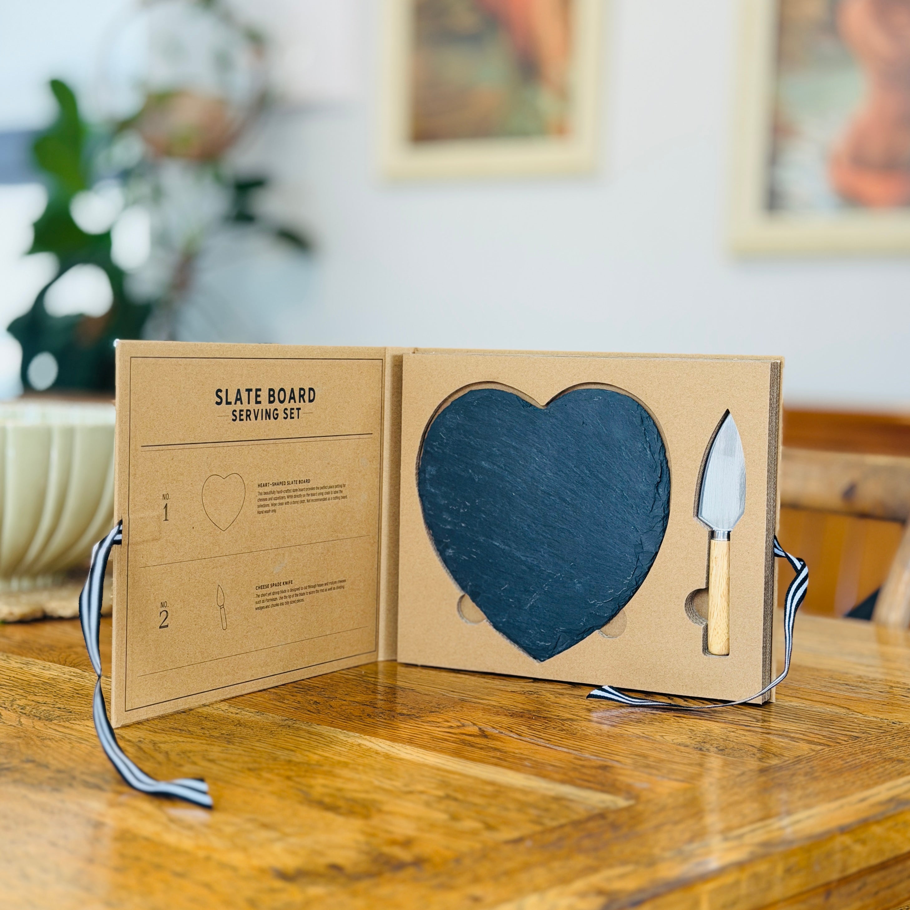 Slate serving board set in the shape of heart with knife and slate board