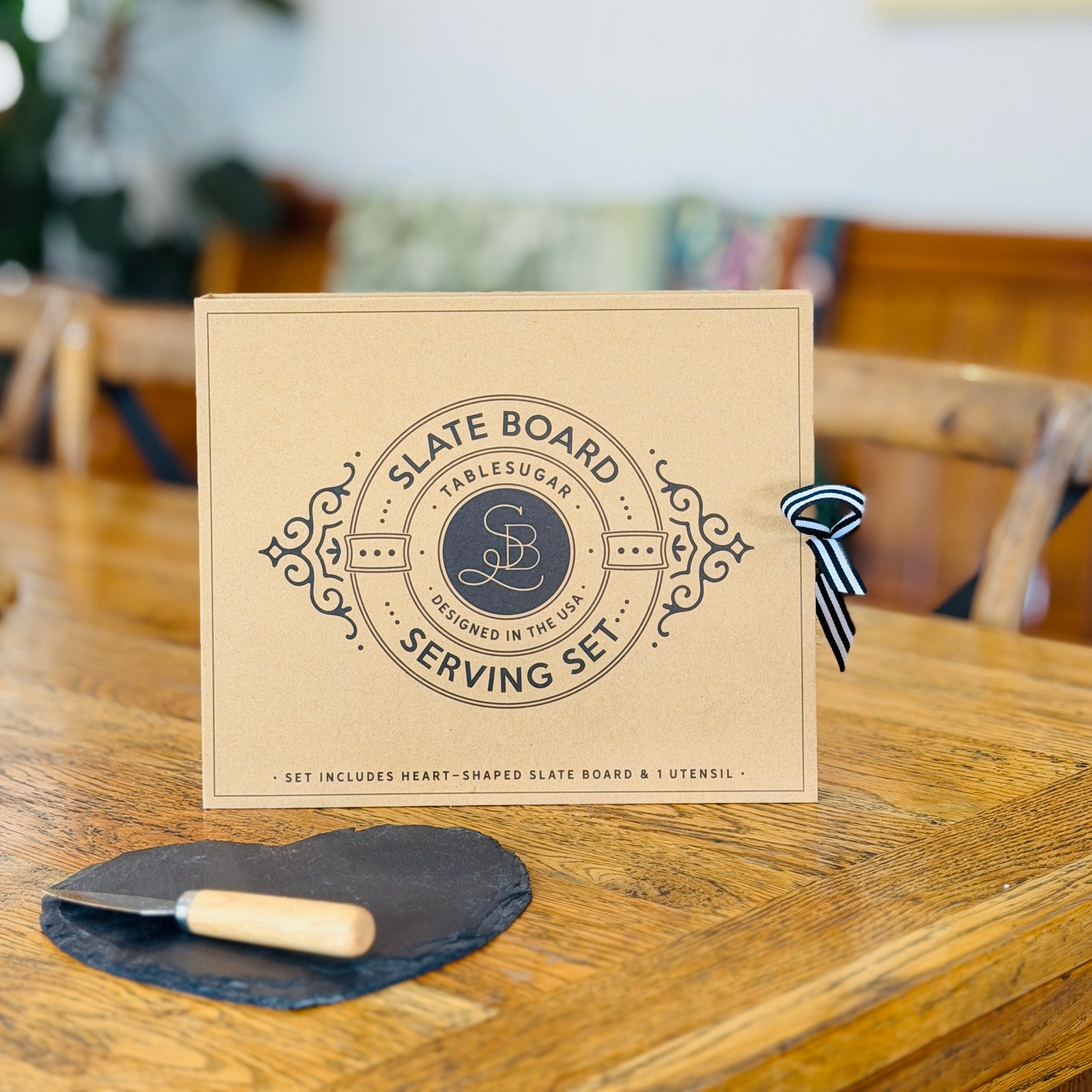 Slate serving board set in the shape of heart with knife and slate board