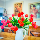fresh tulip steps in a vase on a table