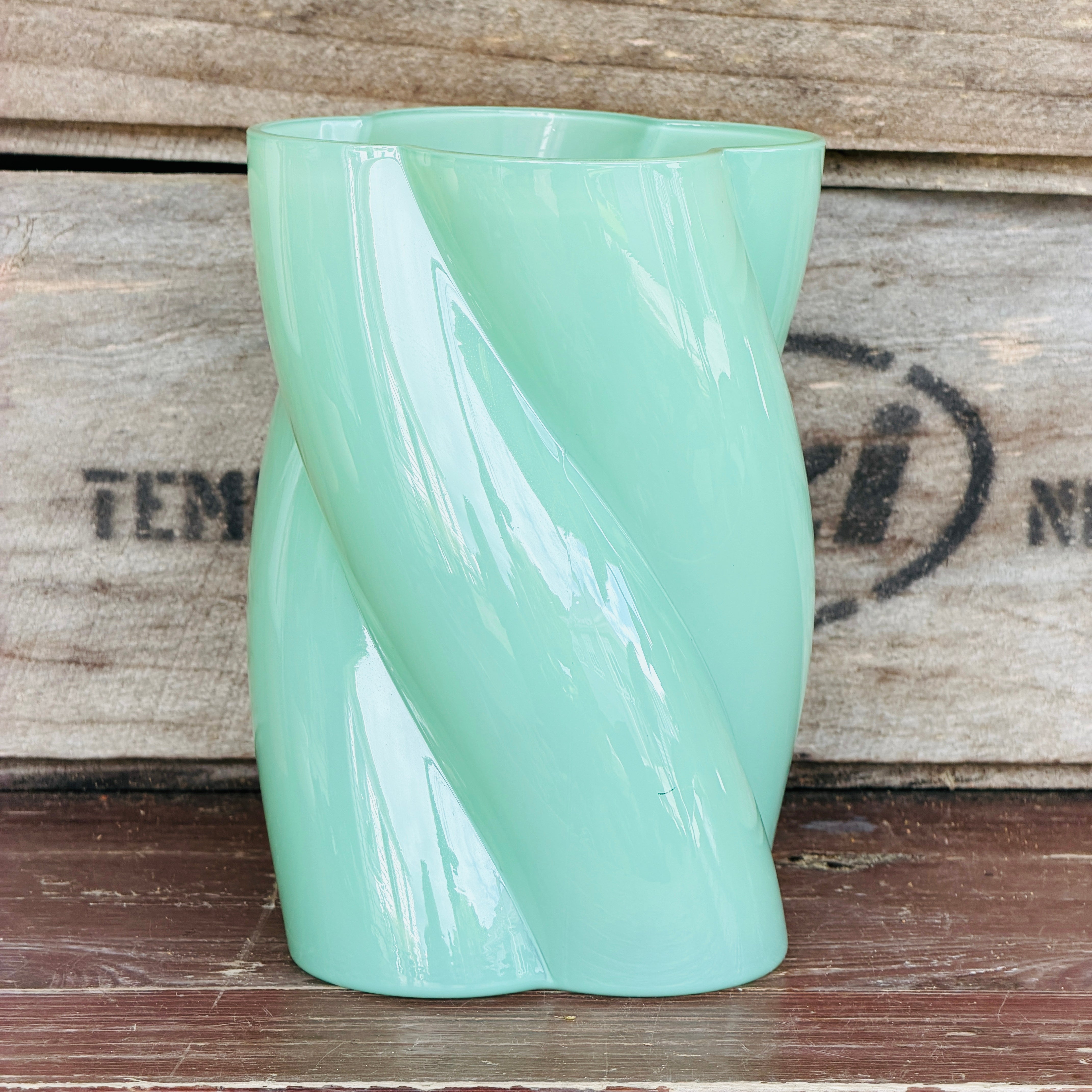 A green glass flower vase