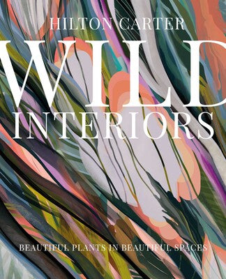 Book cover of 'Wild Interiors' by Hilton Carter with abstract design and text.